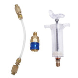 Système d'injection d'huile ou traceur pour circuit de climatisation